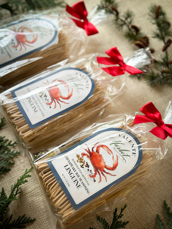 Three Gift Bags of Chesapeake Bay Linguine gift bags with a mini olive oil and tied with a red bow
