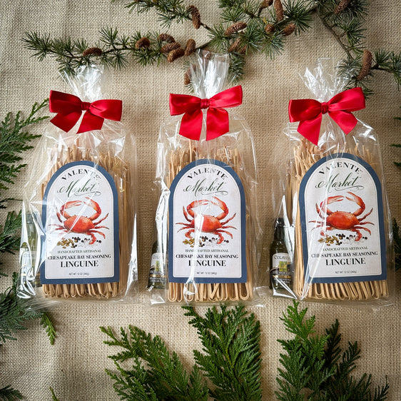 Three Gift Bags of Chesapeake Bay Linguine gift bags with a mini olive oil and tied with a red bow