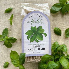 Valente Market Basil Angel Hair labeled pasta with basil leav art and lavender border on burlap with fresh basil