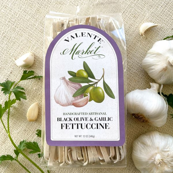 Black Olive and Garlic Fettuccine in clear bag with pale purple label
