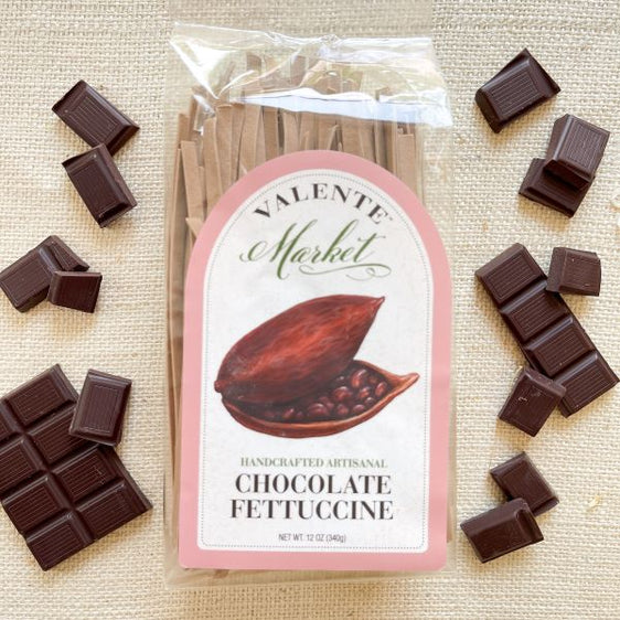 Chocolate fettuccine clear bag, cocoa pod and pink border with squares of chocolate
