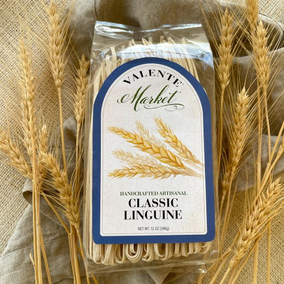 Classic linguine pasta in a clear bag with a mid-blue border on the  label. Wheat stalks surround the bag