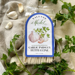Garlic parsley fettuccine pasta in a clear bag with pale blue  border on the label.