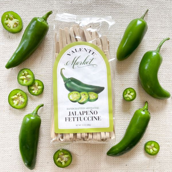 Jalapeni pepper fettuccine pasta in a clear bag with jalapeno pepper featured on the label with a lime green border