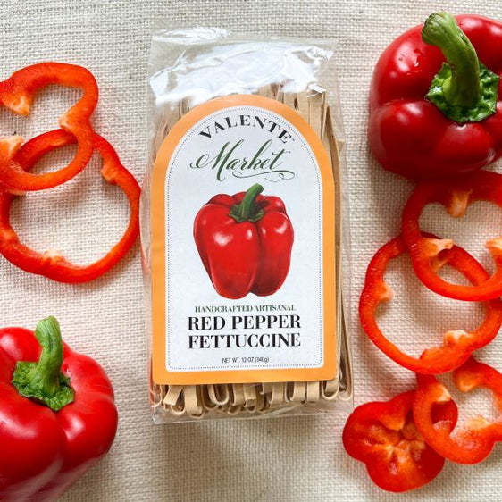Red pepper fettuccine in a clear bag with red bell pepper  on the label with a pumpkin colored border