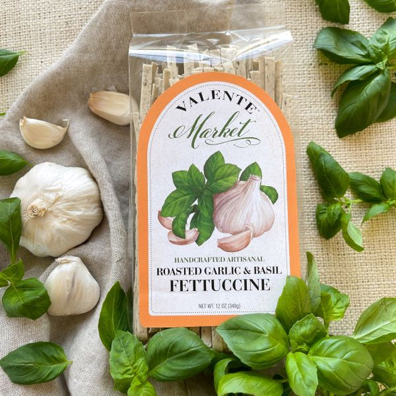 Roasted garlic and basil fettuccine in a clear bag with orange border on thelabel